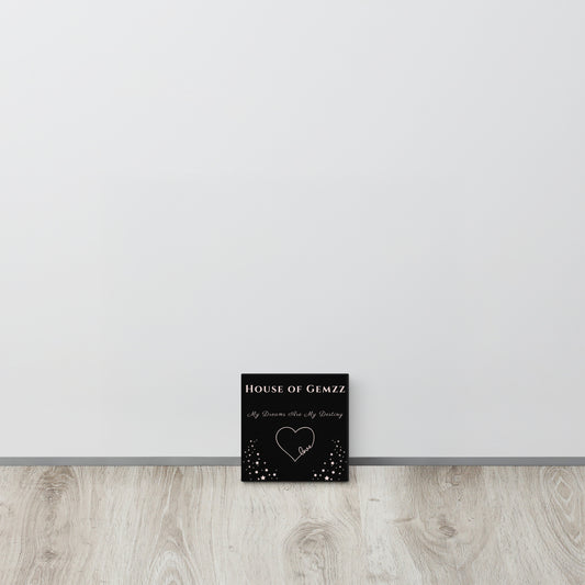 Black card with 'House of Gemzz' text and heart design on a white wall.