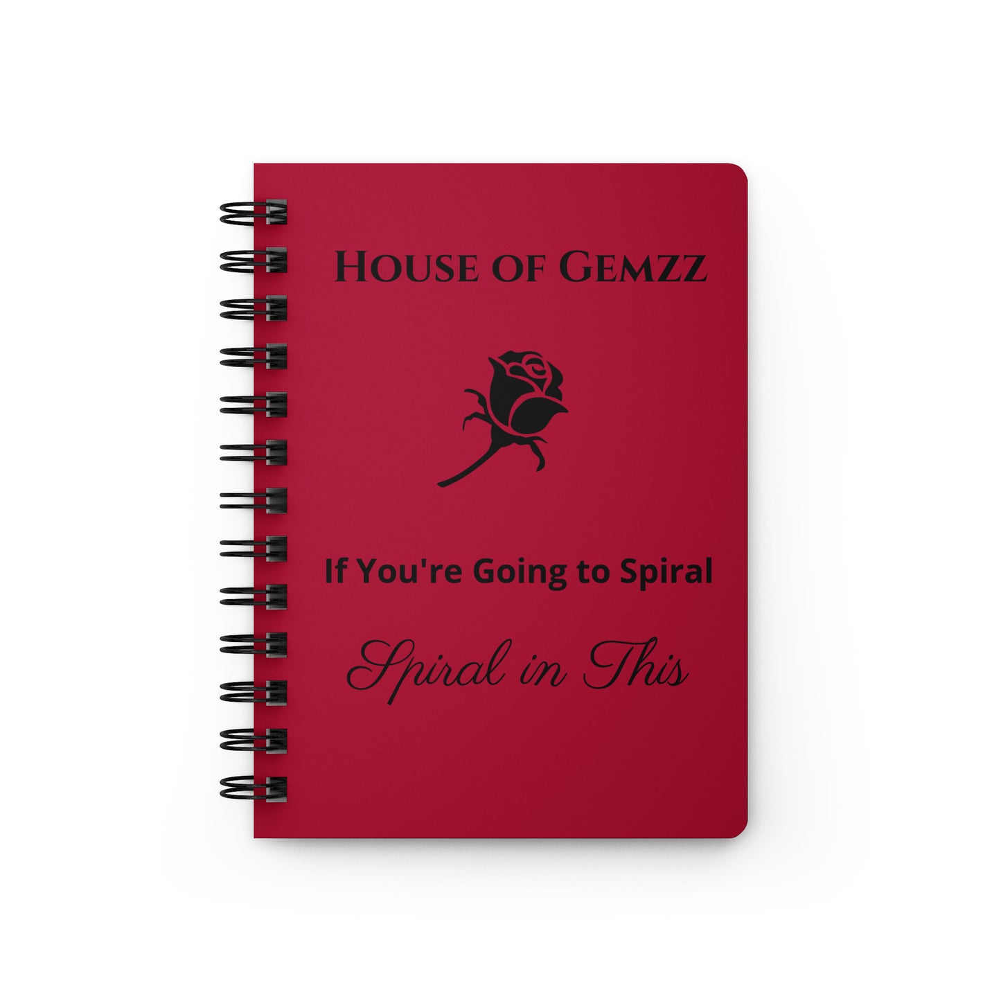 Red notebook with 'House of Gemzz' branding and text on a white background
